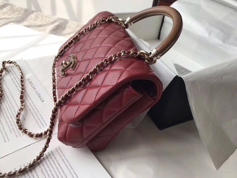 Ch**el flap bag with top handle wine red 21cm