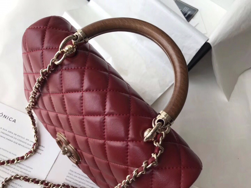 Ch**el flap bag with top handle wine red 21cm
