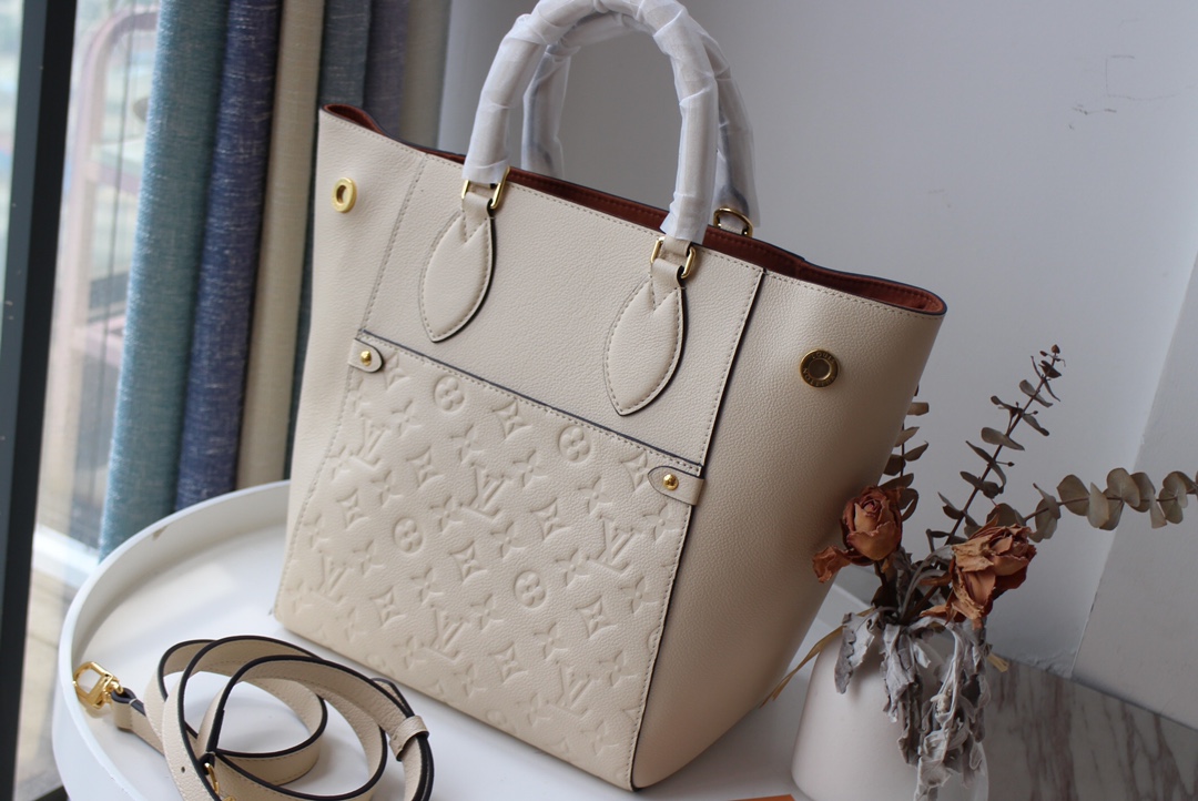 l0vis Vvtt0n fold tote mm monogram empreinte leather creme m45409 23 x 28 x 19 cm